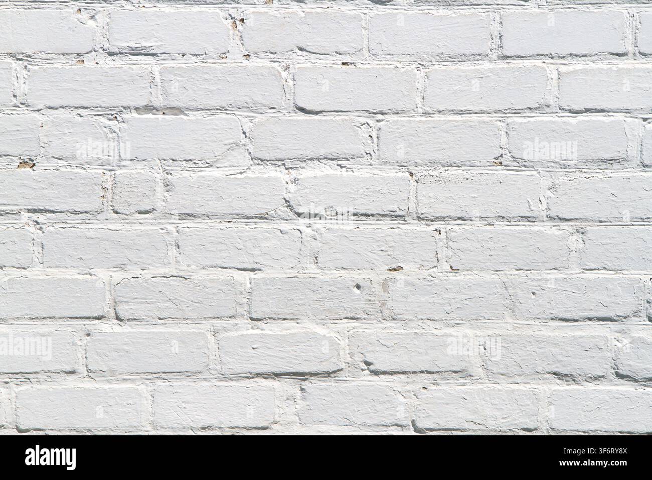 Uniform texture of light brick wall. Old whitewashed brickwork. Stock Photo
