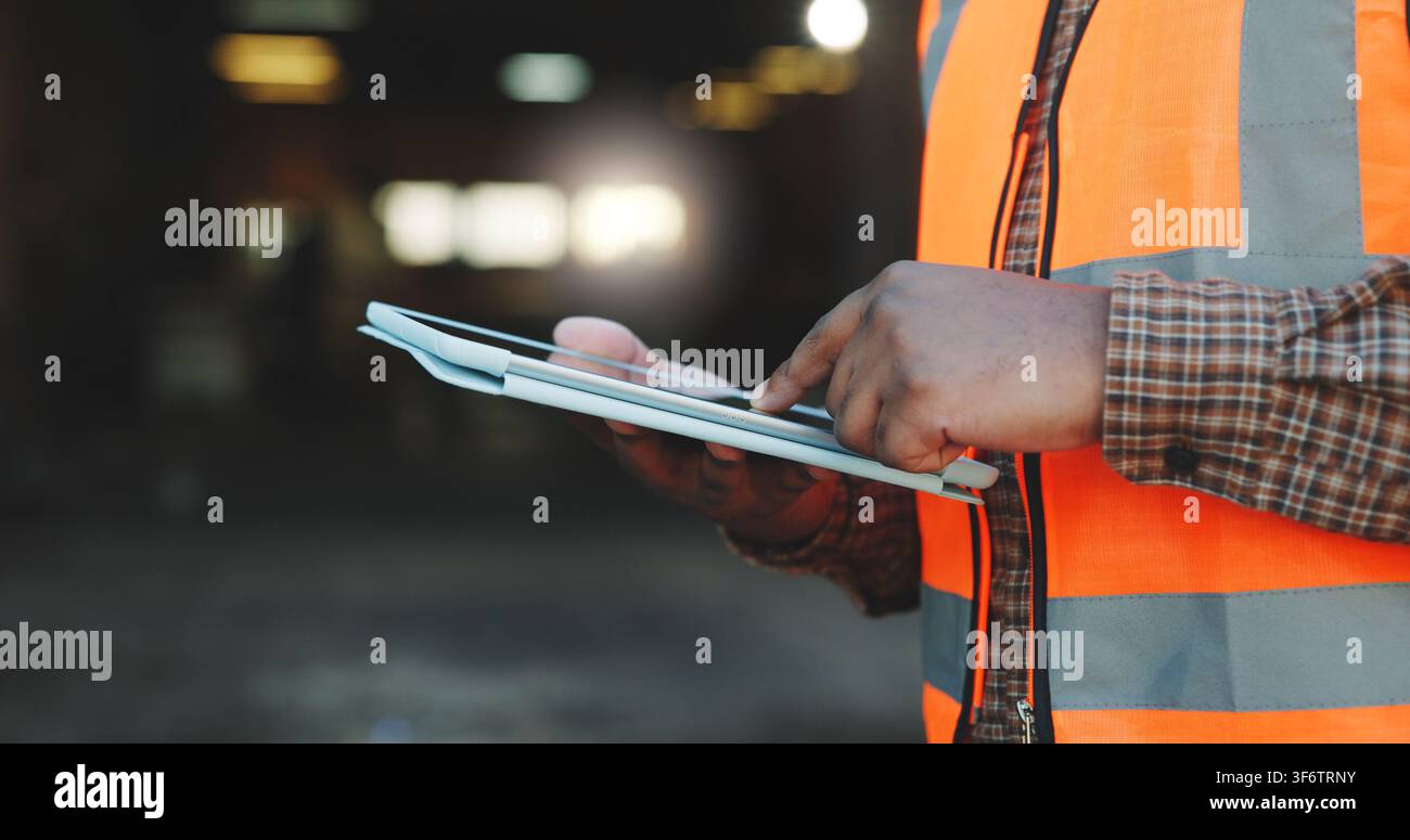 Construction, scroll or hands on site with tablet, task brief or inspection report on development. Space, man or engineer with tech, project Stock Photo
