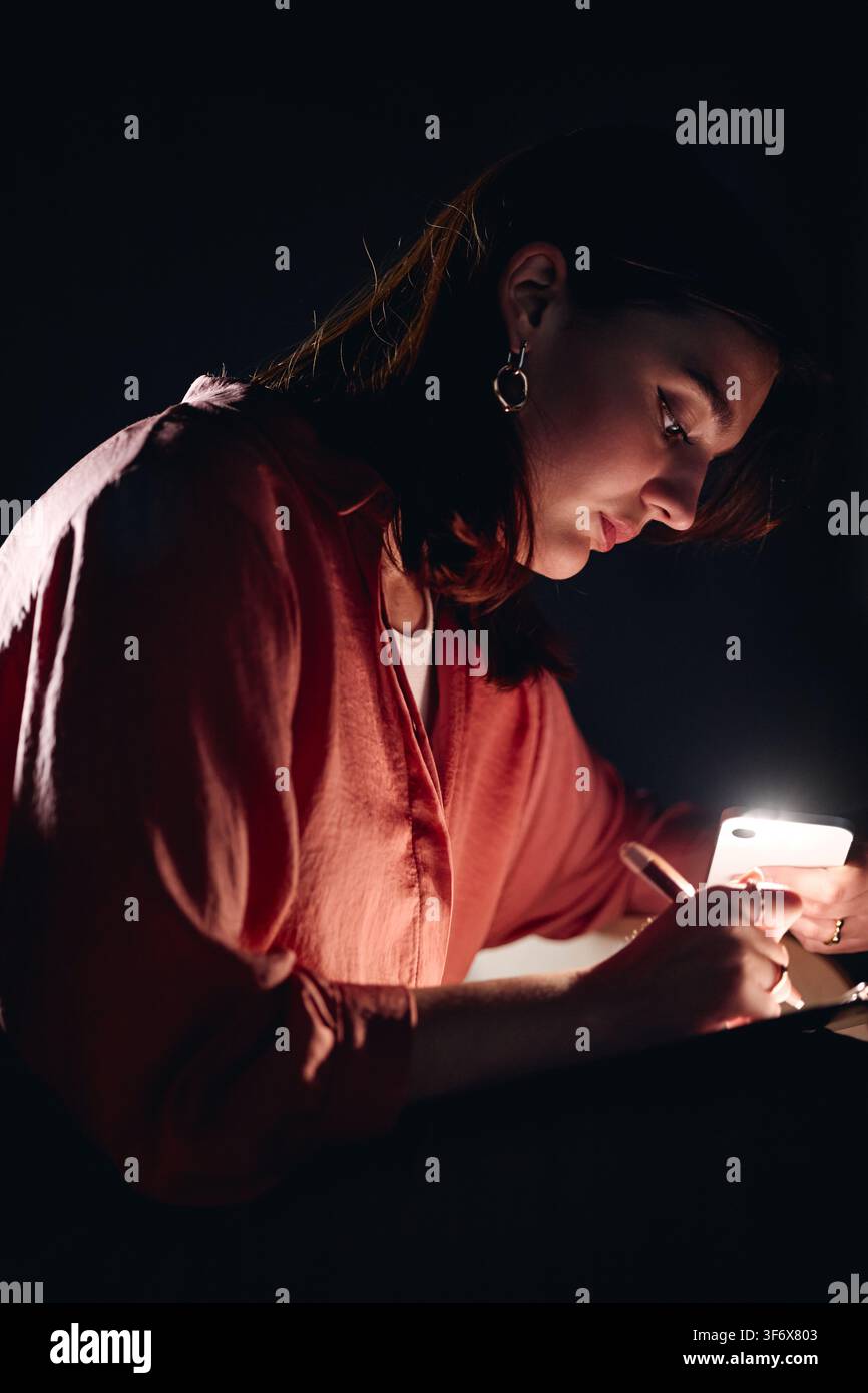 Girl Writing Script Backstage during Student Theater Production Stock Photo