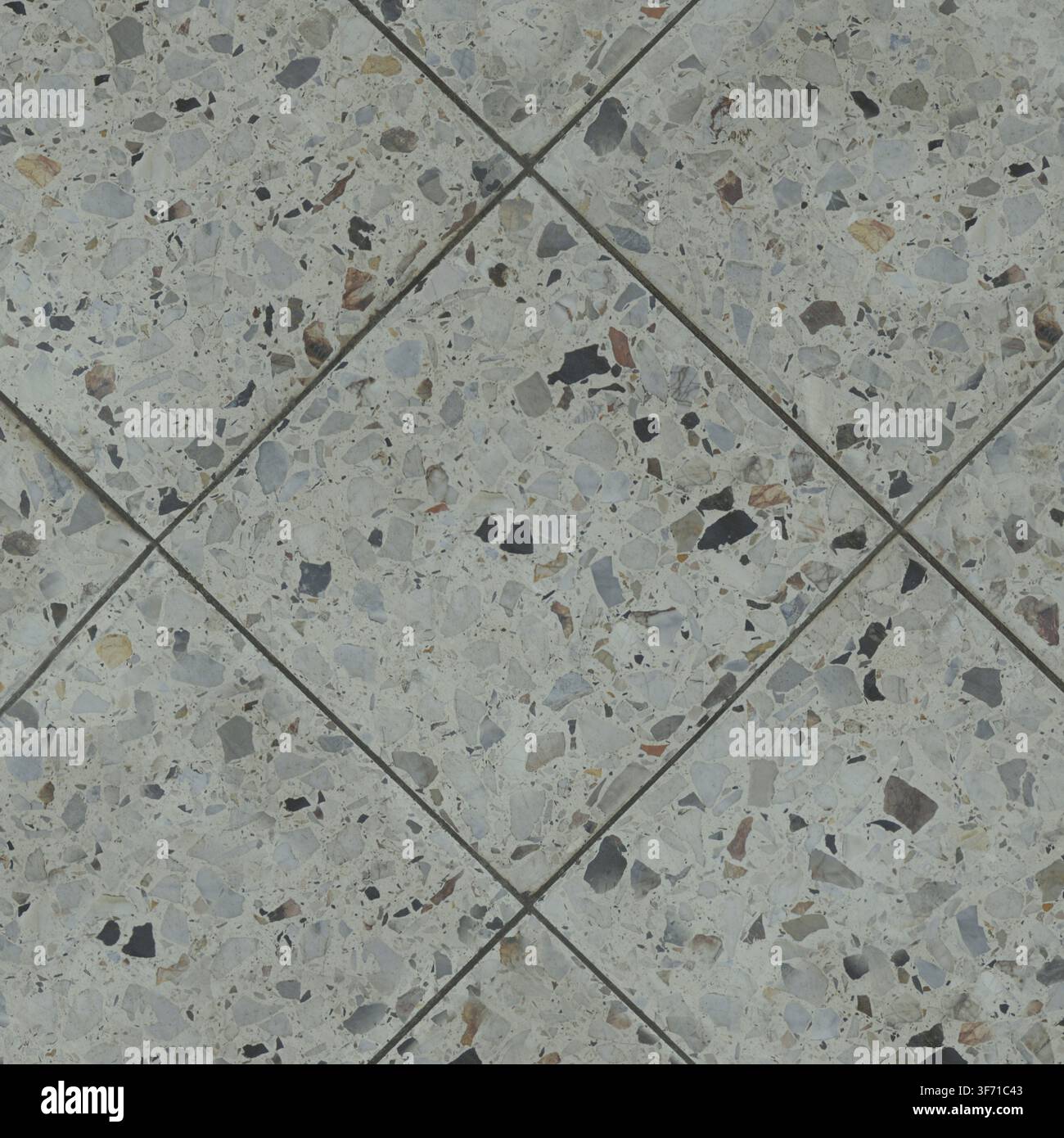 A high resolution seamless texture of grey terrazzo stone tiles with marble aggregate chips. Stock Photo