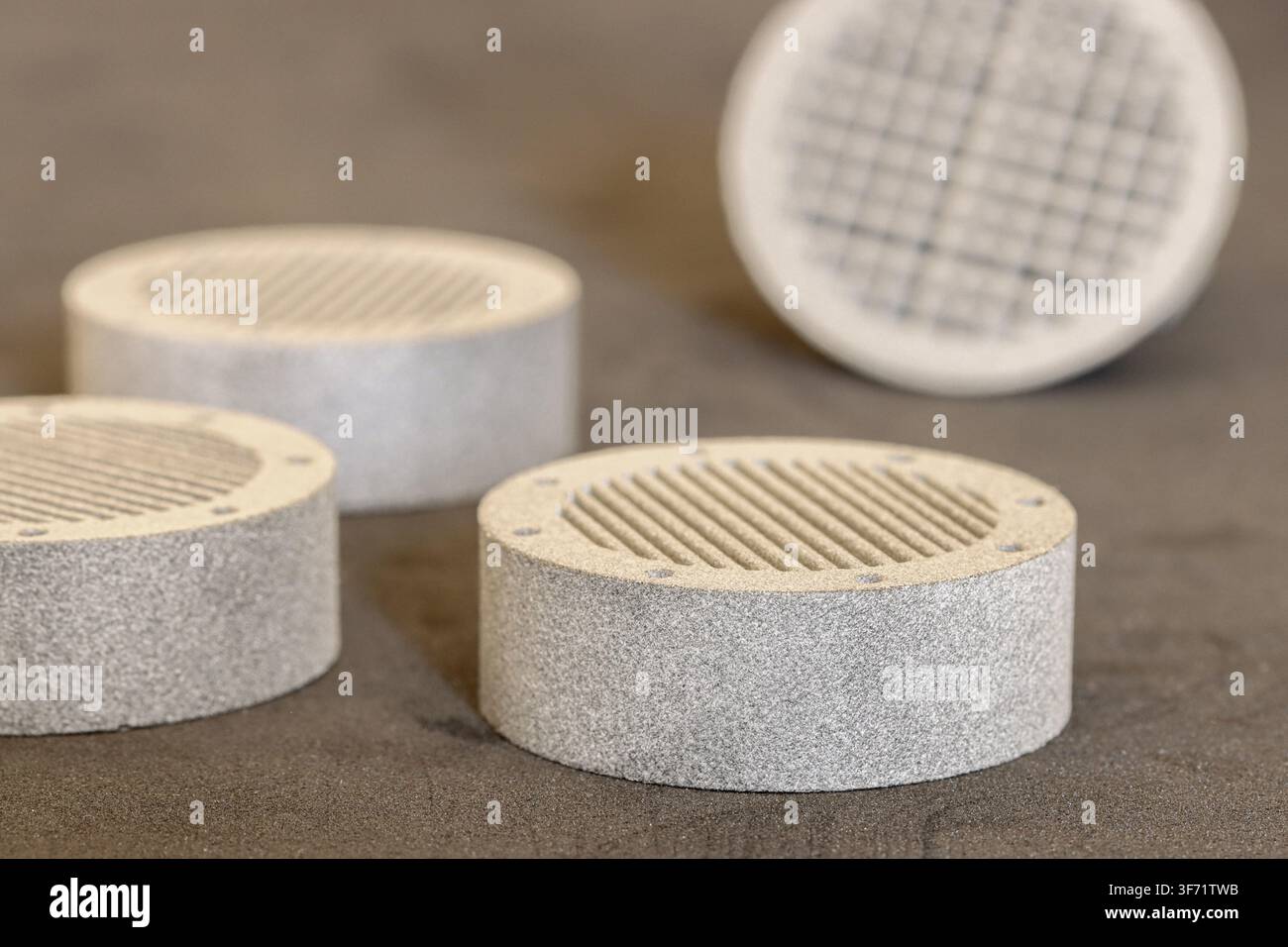 Gray Multi Jet Fusion 3D Printed Prototype Parts on Dark Surface Stock Photo