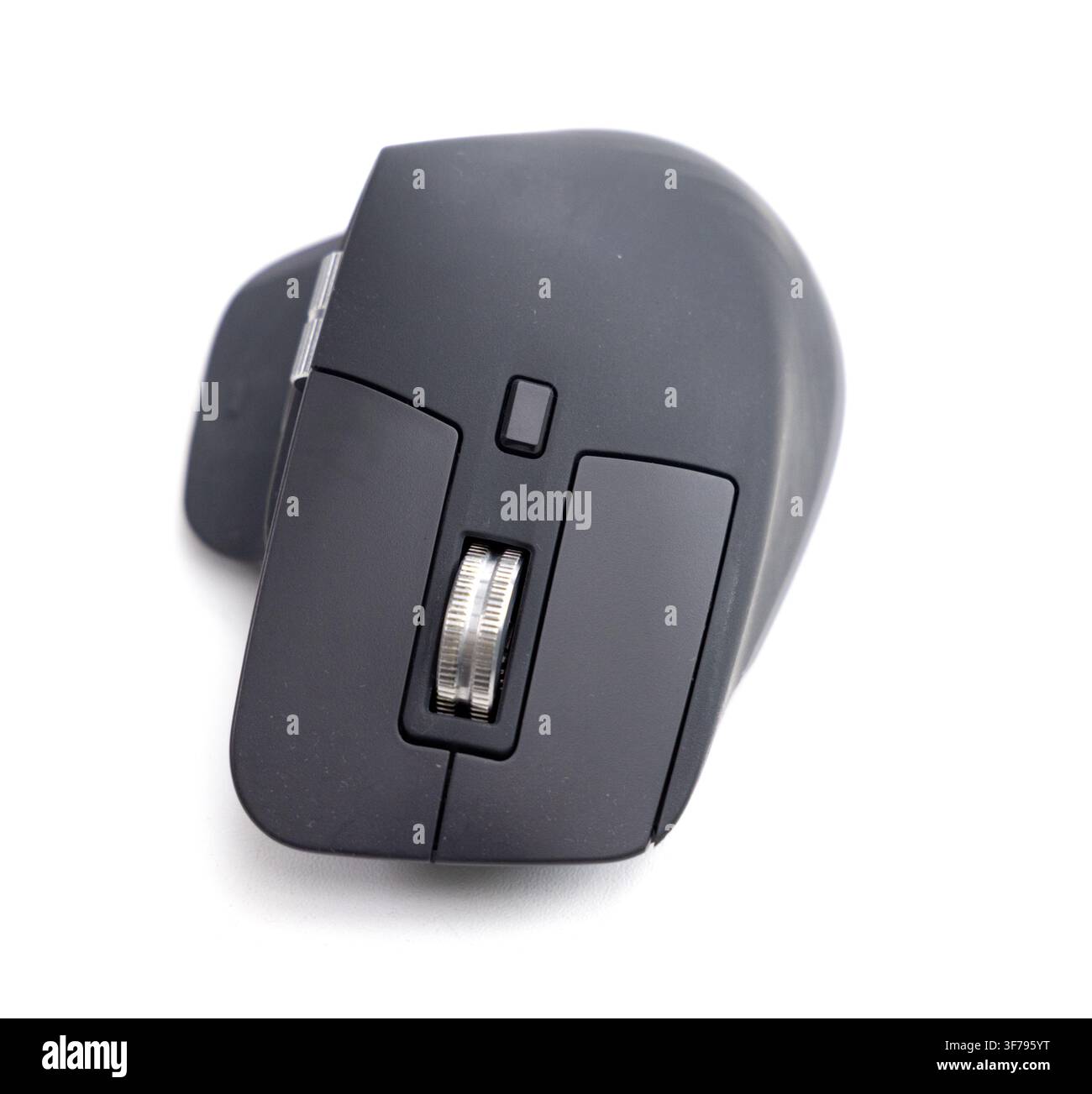 A modern black computer mouse rests isolated on a white background Stock Photo