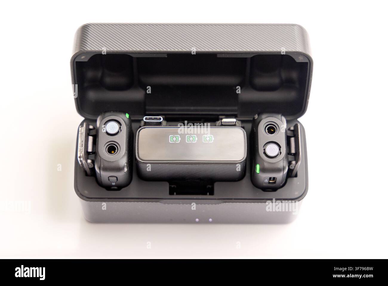 Wireless microphone charging case with transmitters and receiver inside Stock Photo