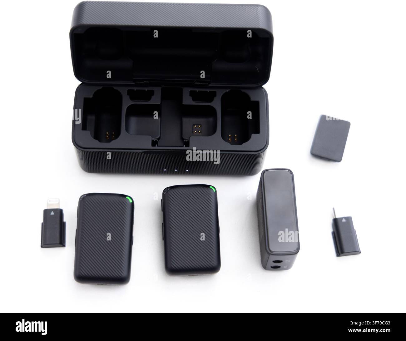 A wireless microphone system with a charging case and accessories Stock Photo