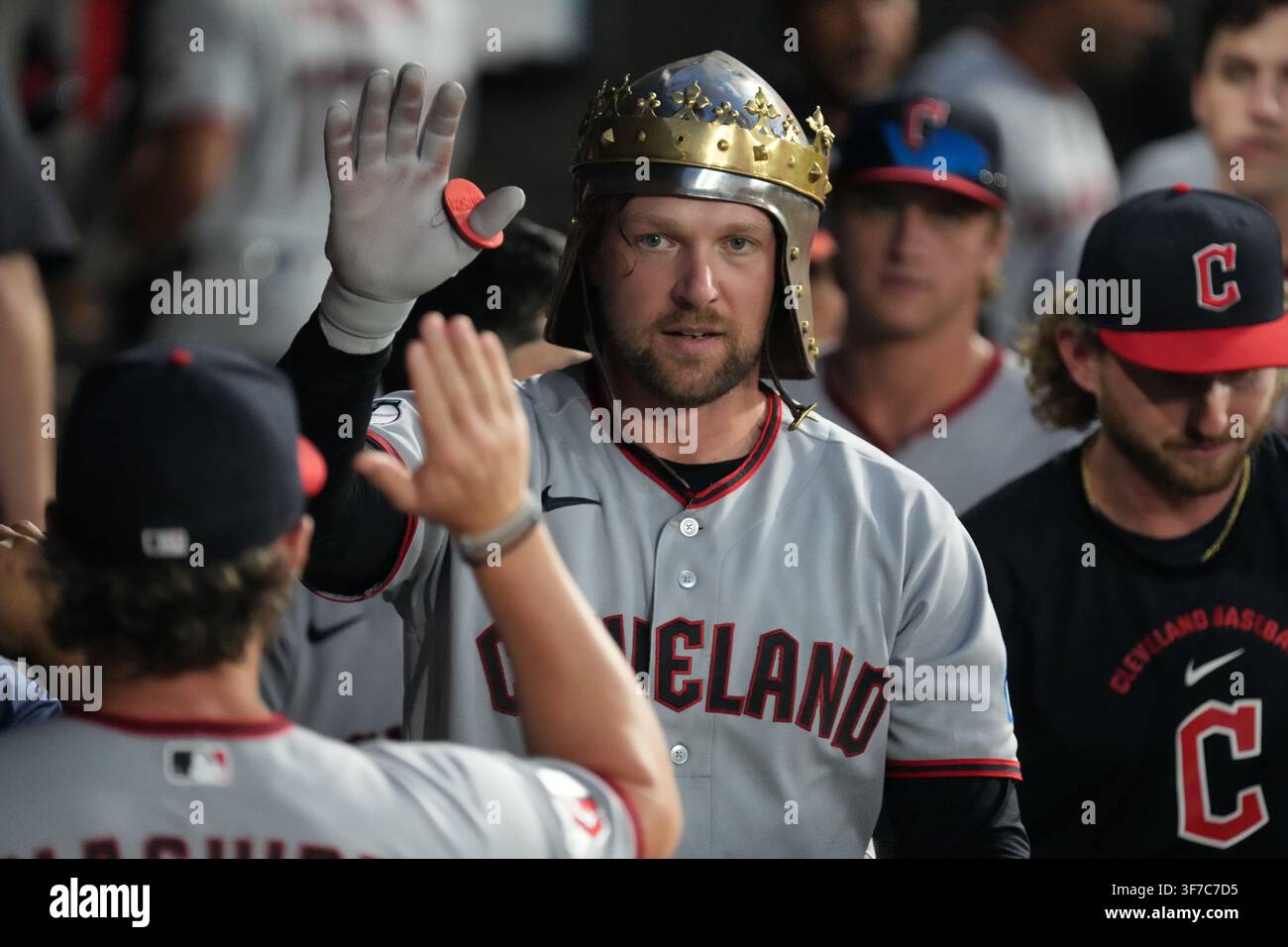 Greeted Cleveland Guardians' Rhys Hoskins is greeted in the dugout after ...