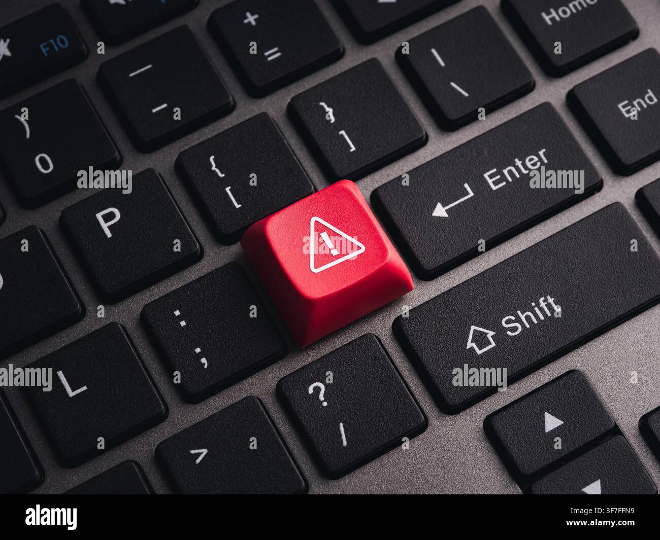Red warning key on computer keyboard symbolizing cybersecurity threats, system alerts, malware detection, cyber attacks, security risks, critical erro Stock Photo