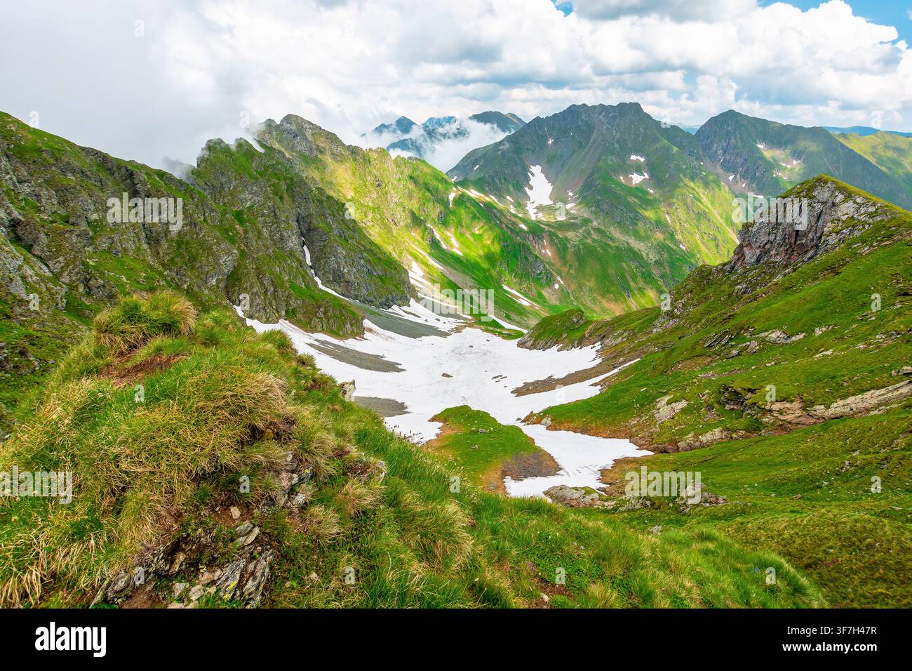 romania mountain landscape in summer. travel background of alpine scenery in fagaras mountain ridge. european summer outdoor adventures Stock Photo