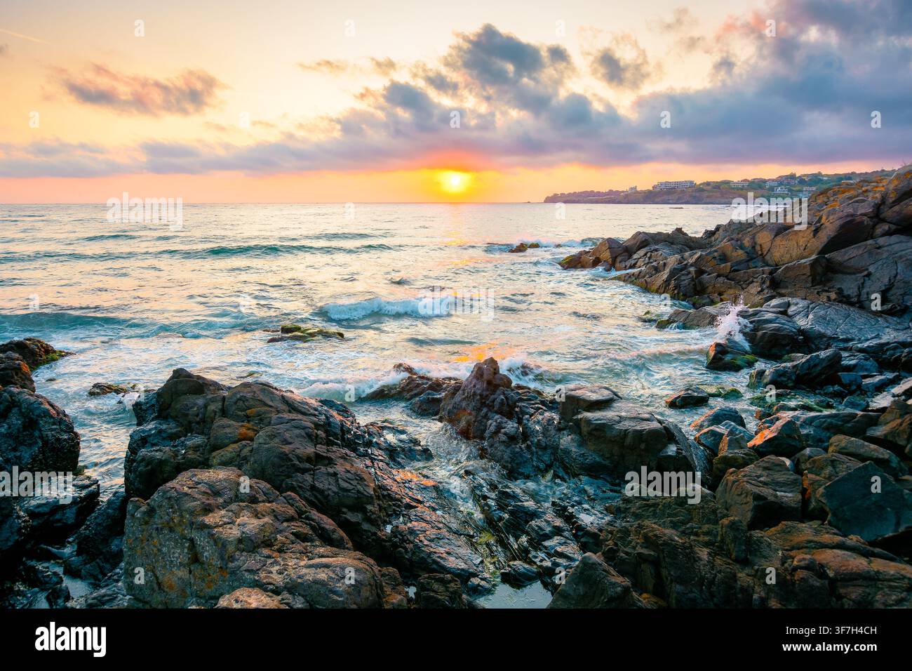 sea landscape at sunrise. rocky coast of bulgaria in summer. dramatic travel background with epic sky Stock Photo