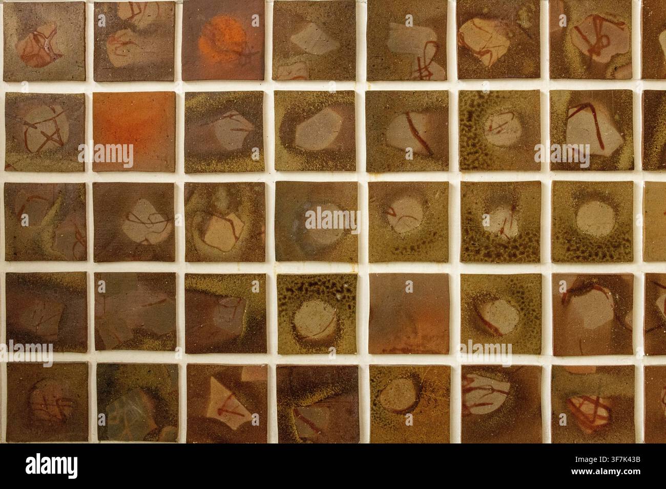 Patterned stone tiles in a square, handmade ceramic tiles, glazed pottery tiles, mosaic wall art Stock Photo