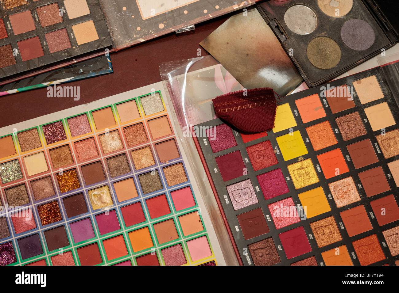 Beauty Brand Eye Shadow Palettes and Fabric Swatch for Costume Color Matching in Cocentaina on August 8, 2026, Spain Stock Photo