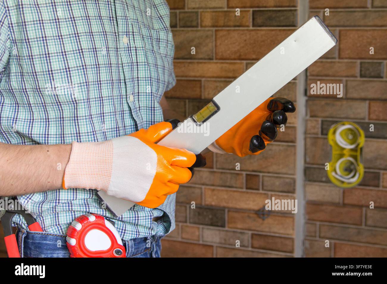 man builder with tools in hands Stock Photo