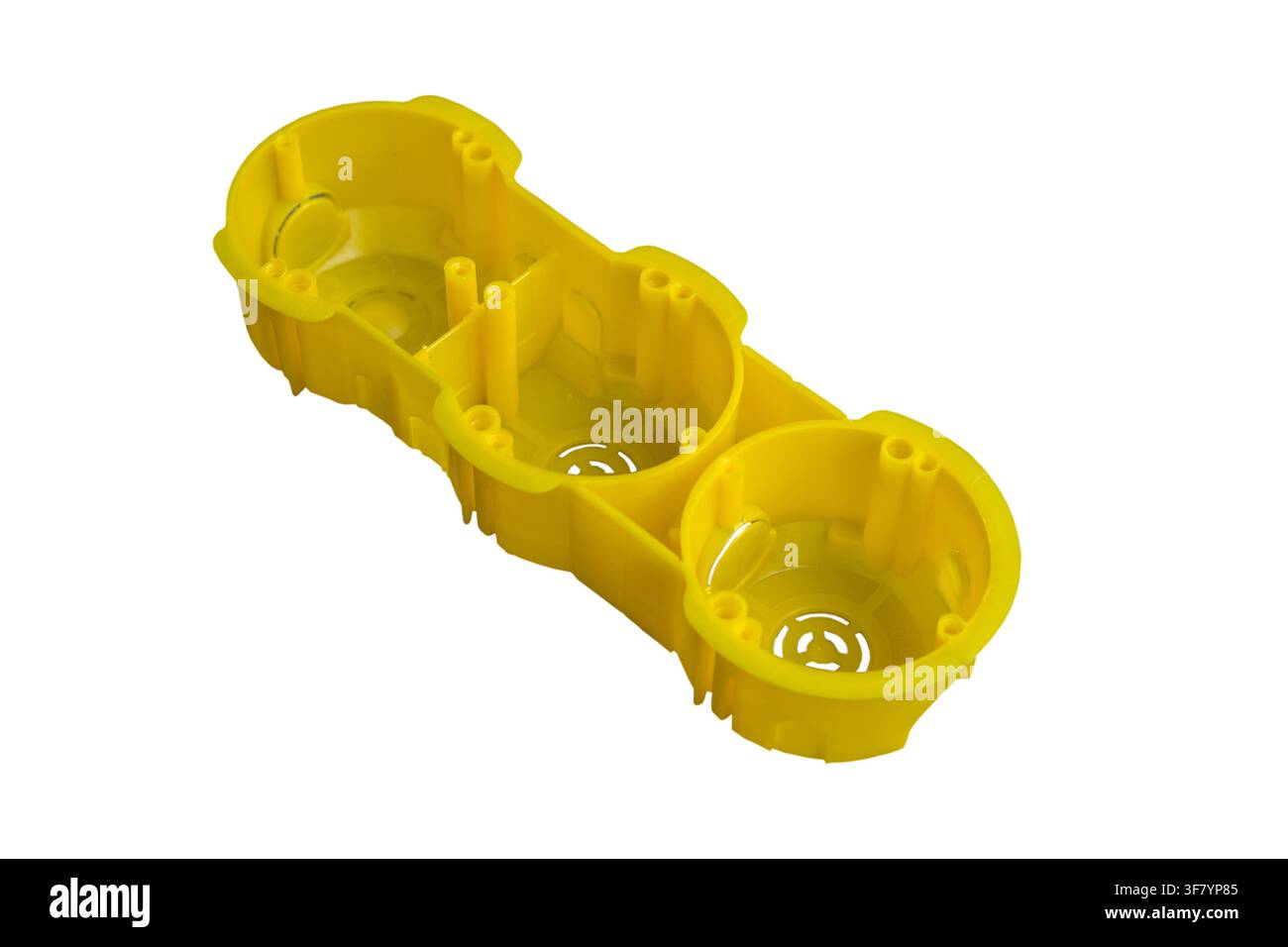 yellow box with three openings for socket and switch isolated on white background Stock Photo
