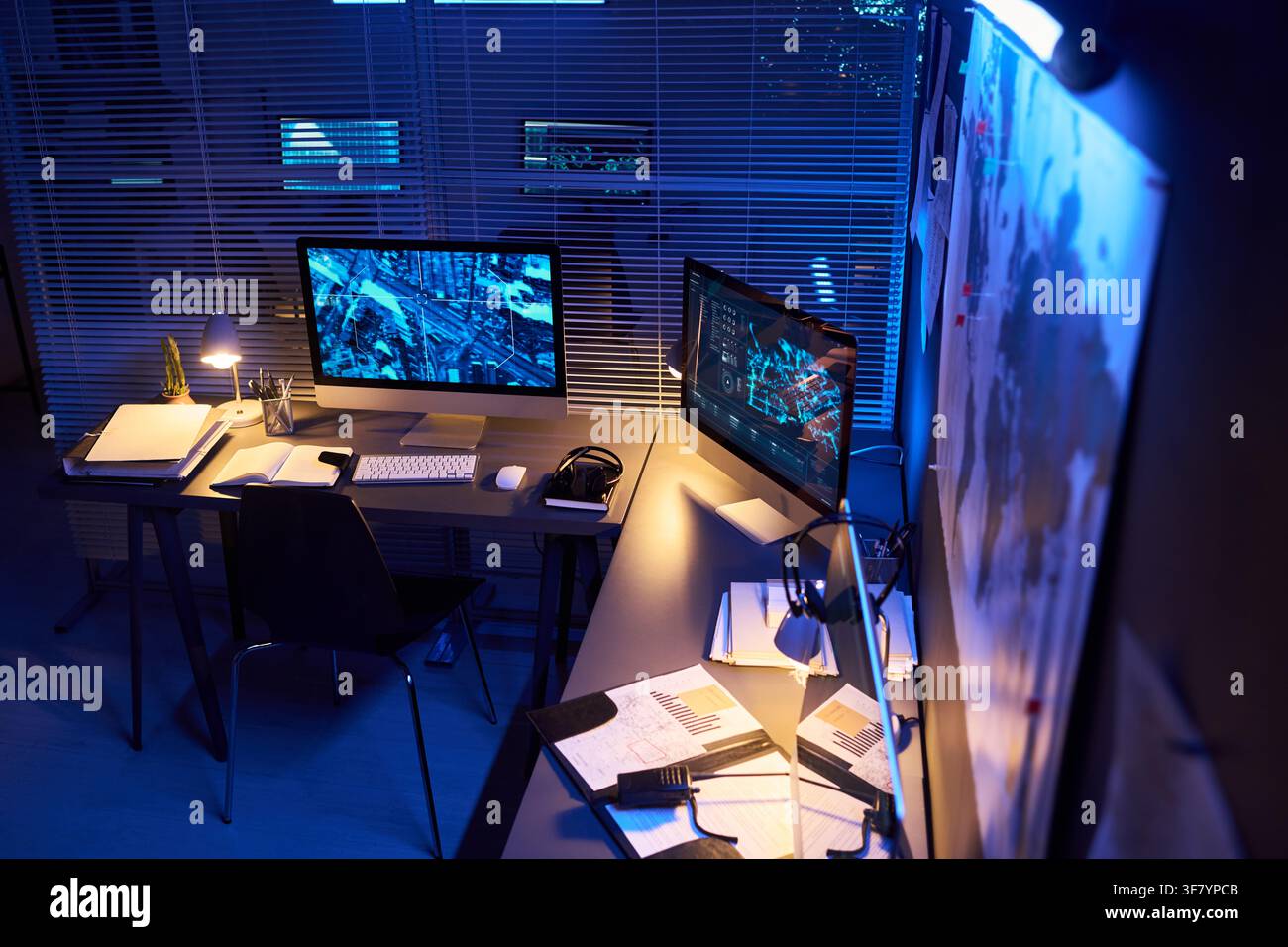 Empty Cybersecurity Control Room with Active Computer Screens at Night Stock Photo