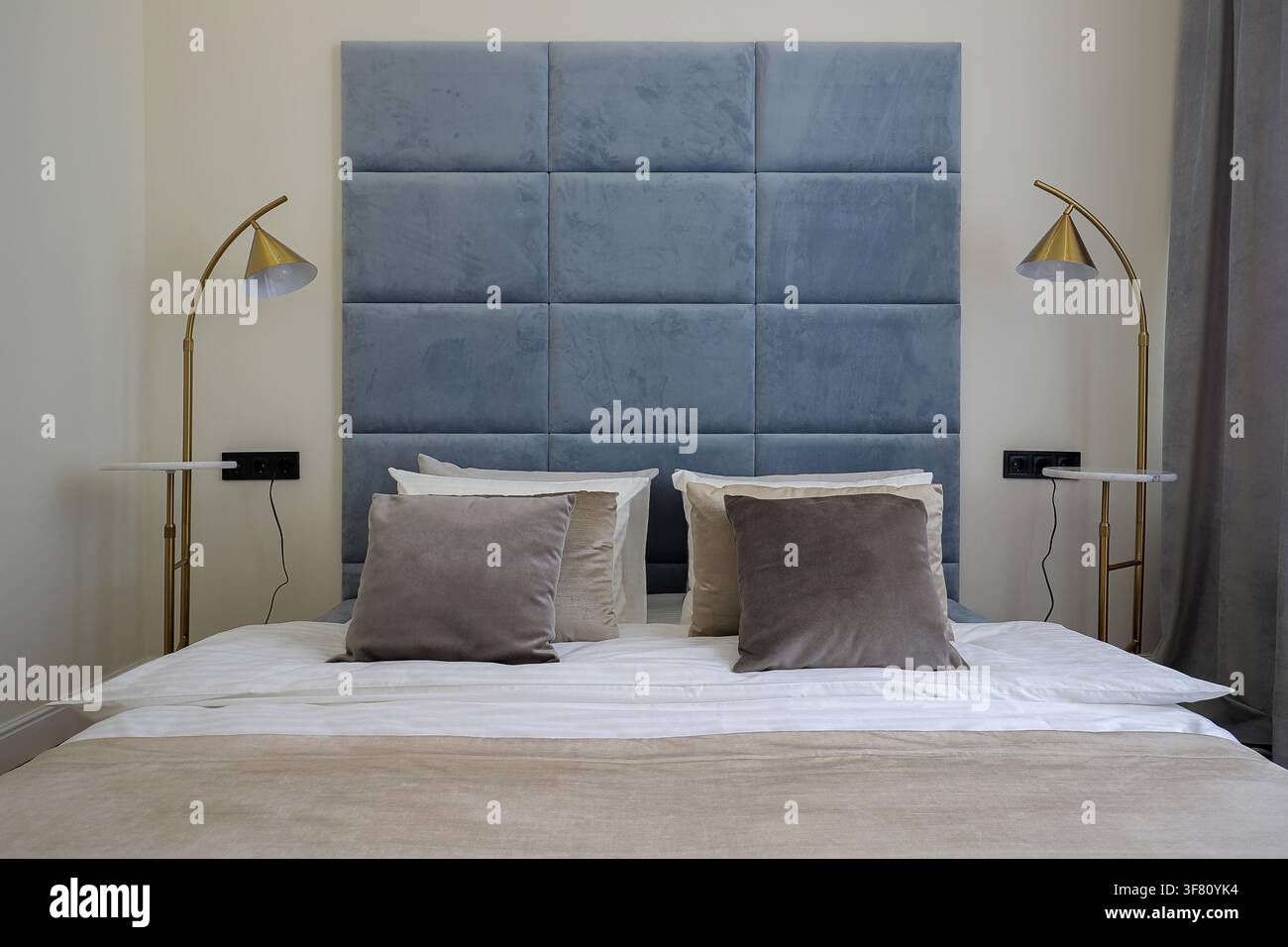 Cozy luxury bed in apartment Stock Photo