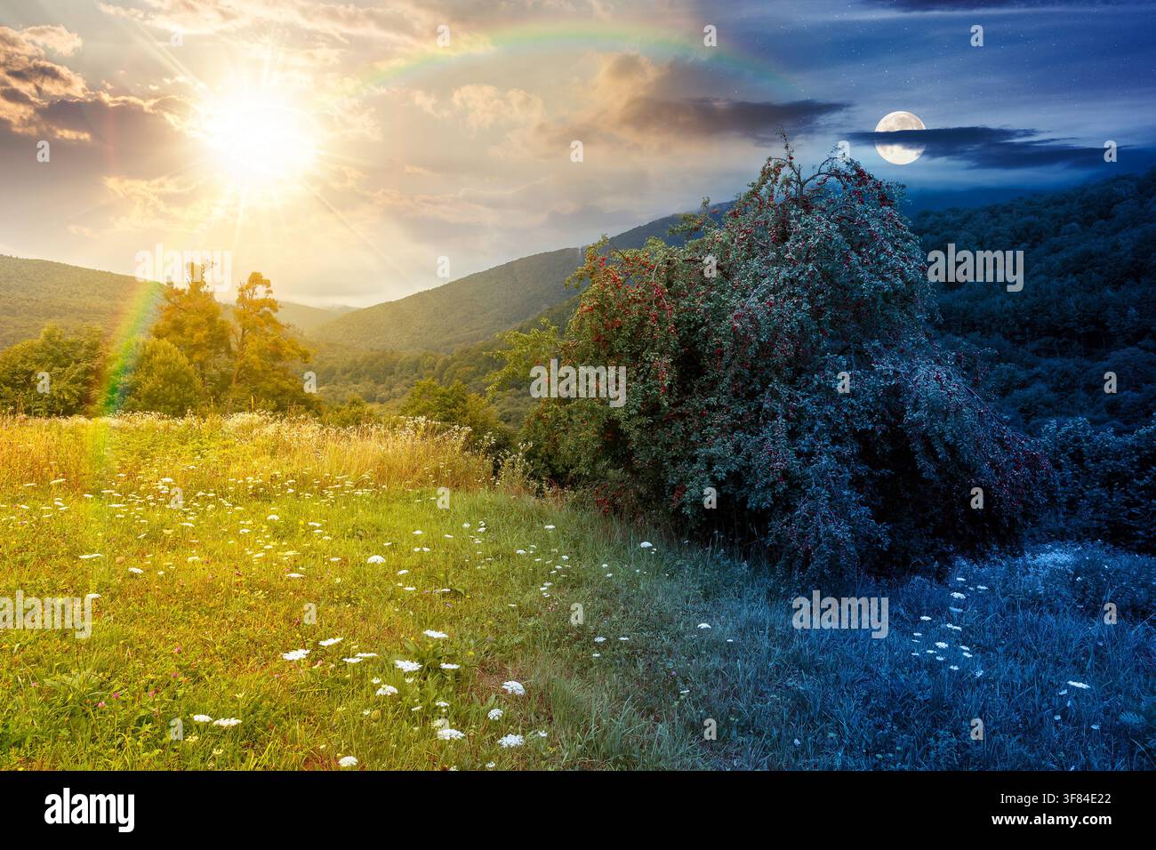 rural mountain landscape of ukraine at twilight. countryside scenery of transcarpathia in summer. night meet day concept. forested hills and grassy me Stock Photo