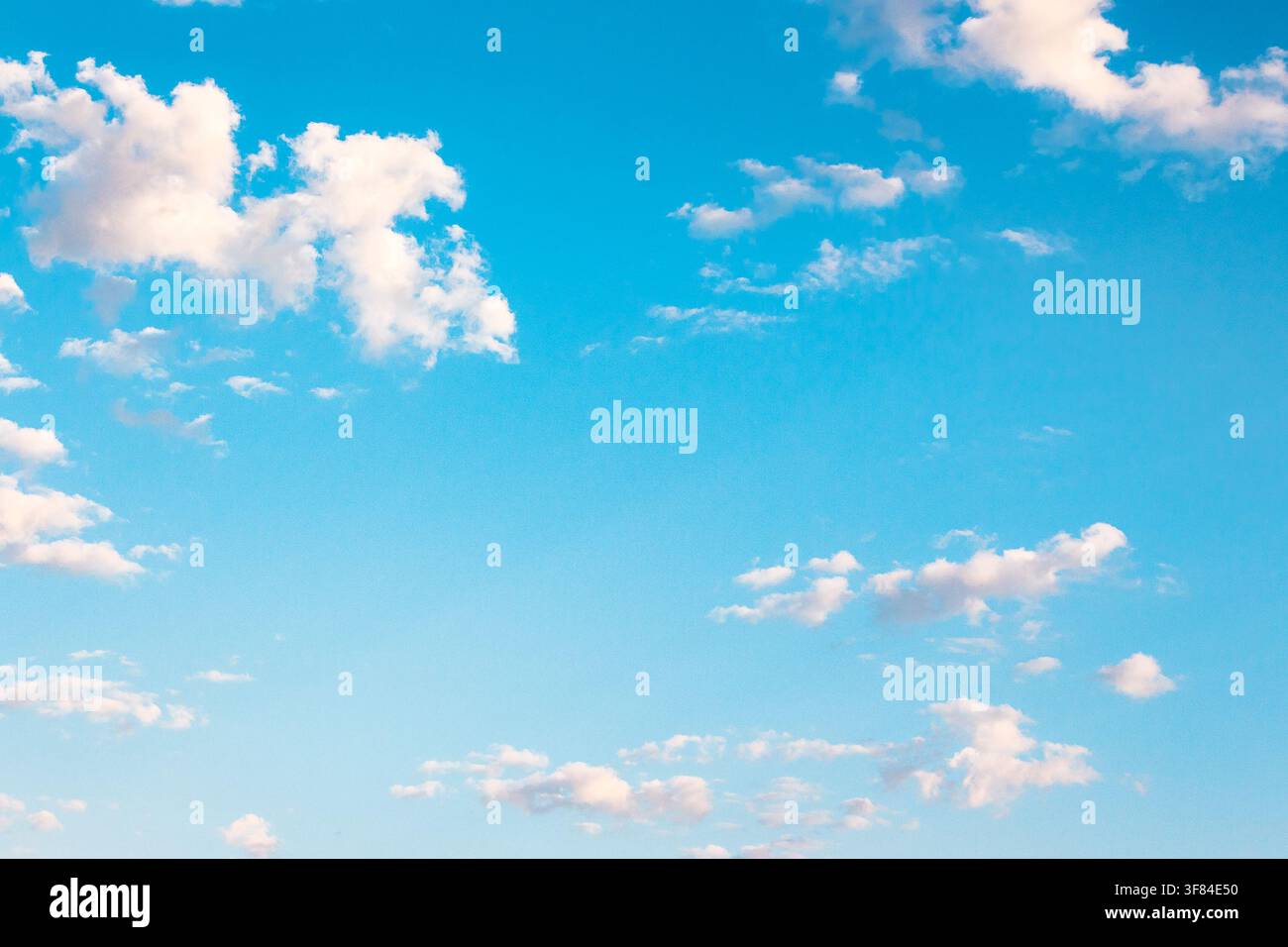 tranquil weather background. nature with fluffy clouds on the blue sky. atmospheric morning wallpaper Stock Photo