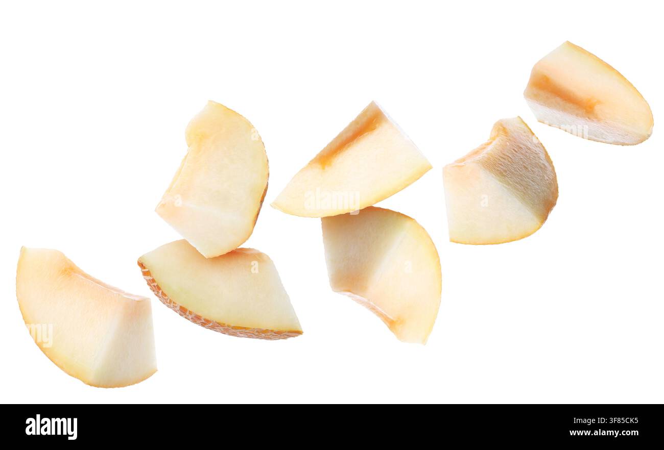 Pieces of melon flying in air on white background Stock Photo
