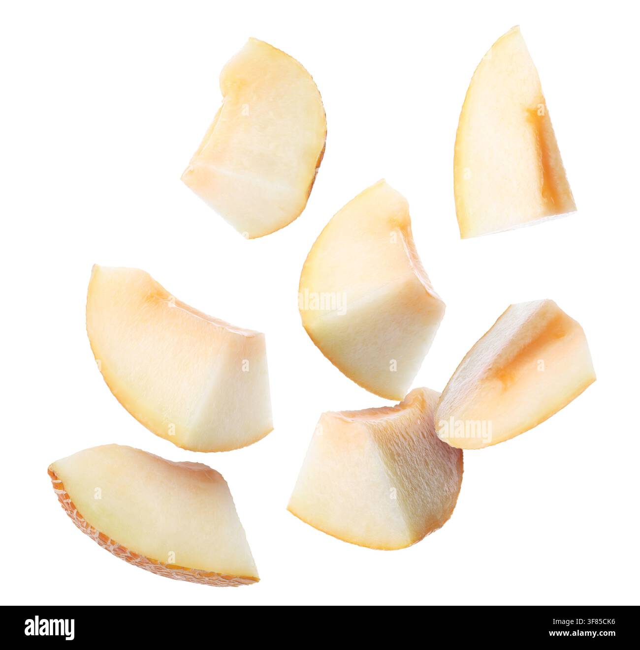 Fresh melon. Pieces flying in air on white background Stock Photo