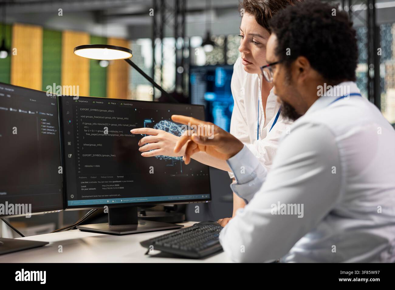 AI startup technicians working together to create deep learning models. Teamworking colleagues collaborating on artificial intelligence project, developing scalable solutions for businesses Stock Photo