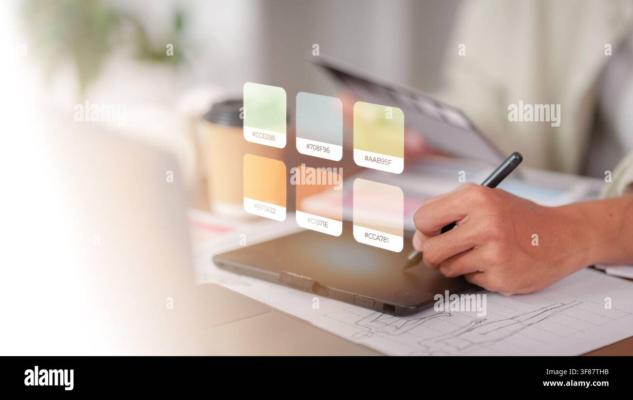 Graphic designer using stylus and digital tablet for color selection Stock Photo