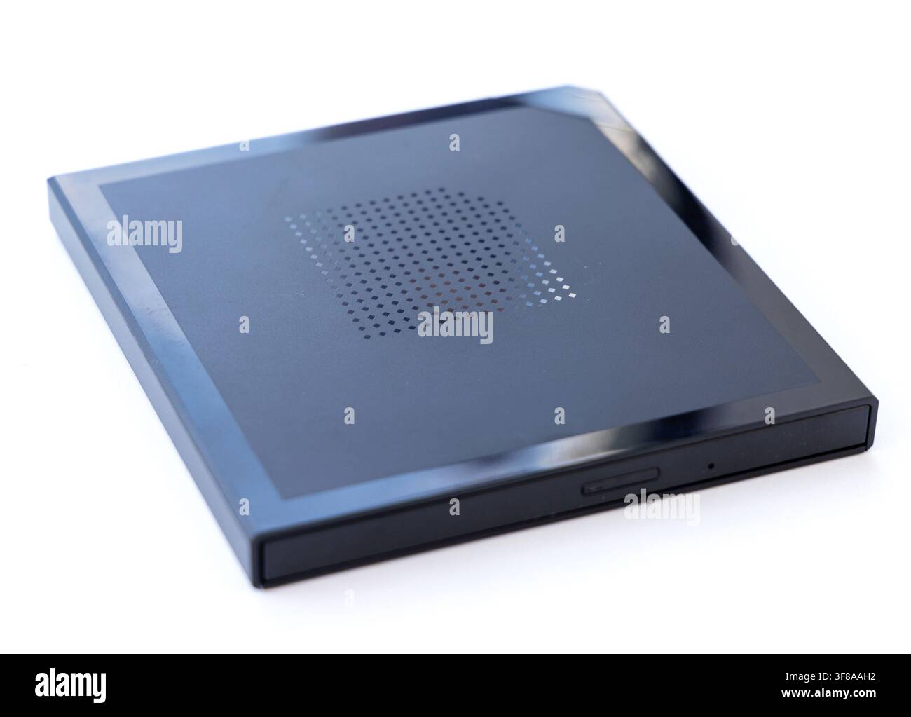 A sleek black external optical drive is presented on a white background Stock Photo
