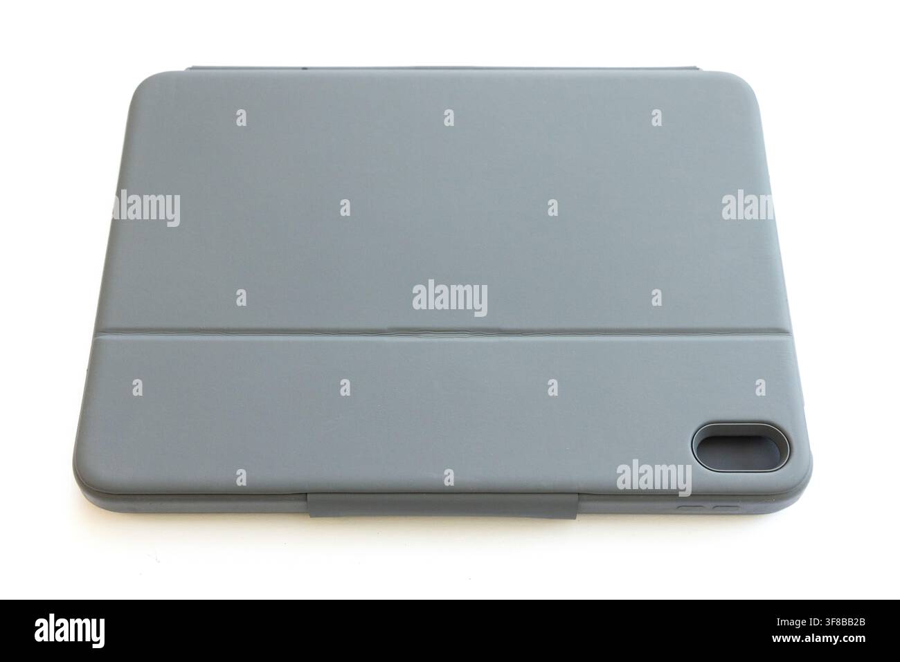 A closed grey tablet protective case rests on white background Stock Photo