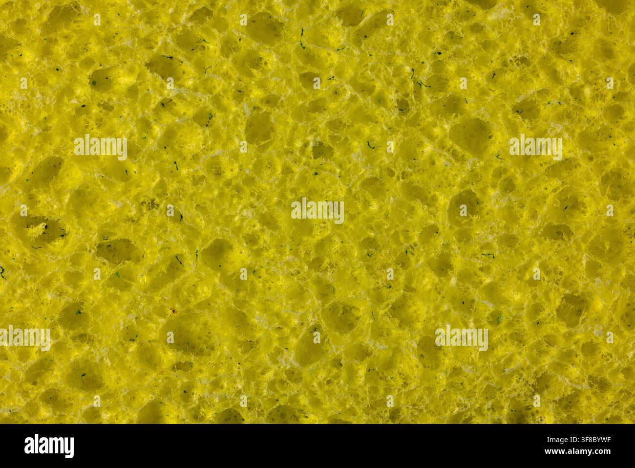 A yellow cleaning sponge closeup. Stock Photo