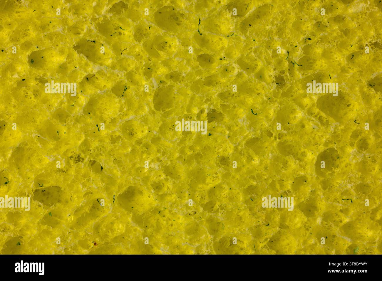 A yellow cleaning sponge closeup. Stock Photo