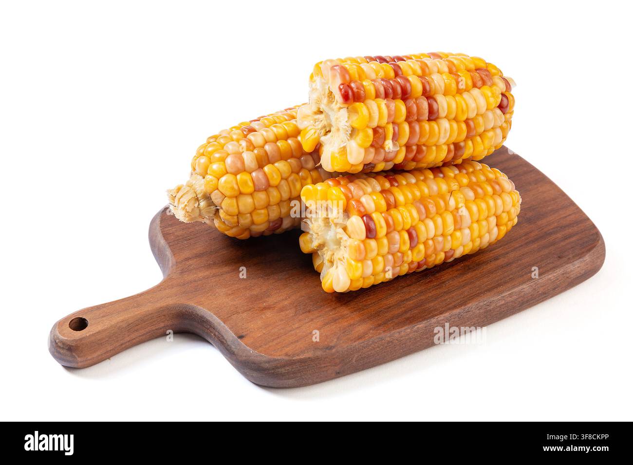 Boiled multicolored waxy corn cobs and cut segments isolated on white background Stock Photo