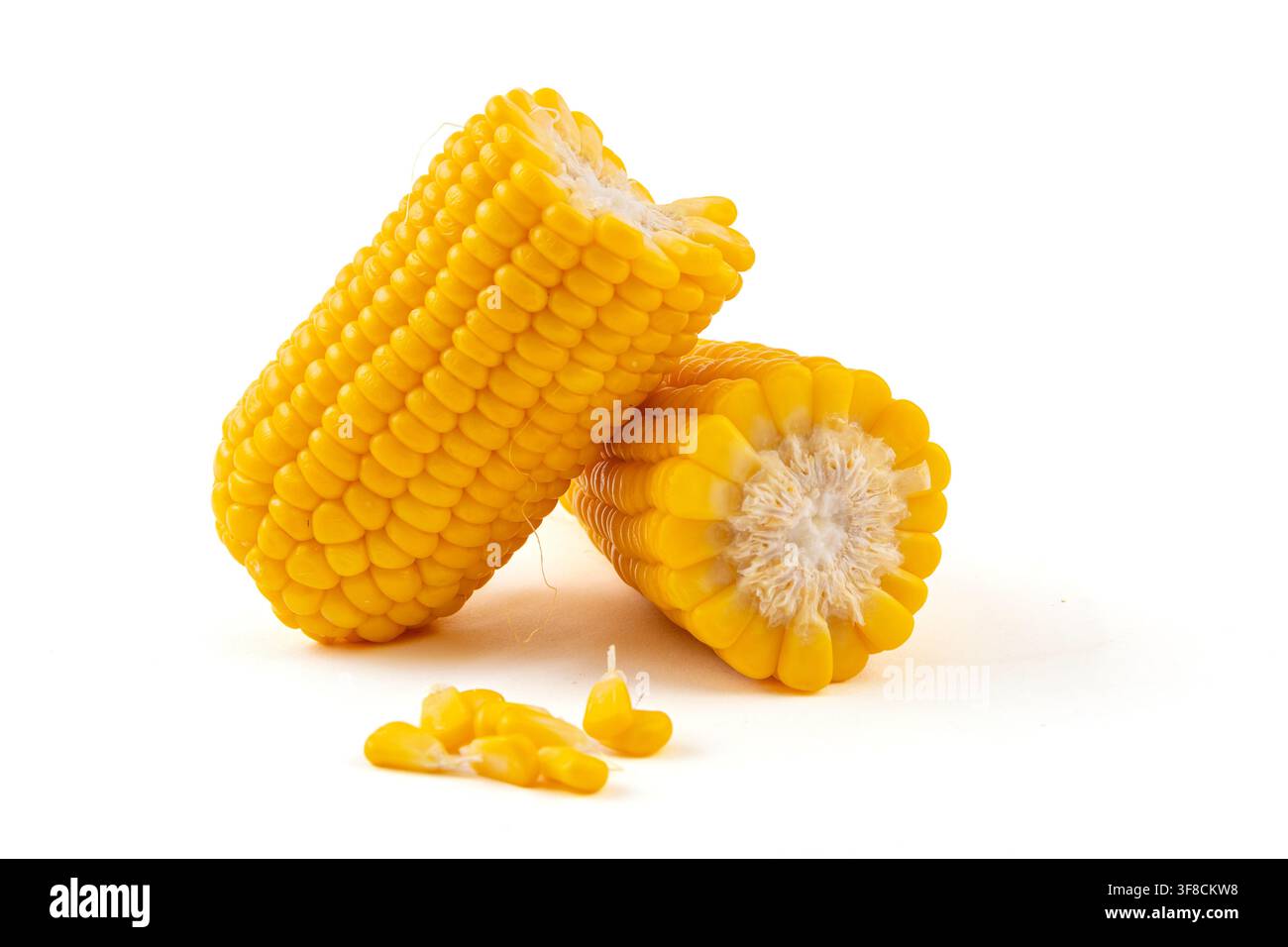 Boiled yellow waxy sweet corn cobs stack isolated on white background Stock Photo