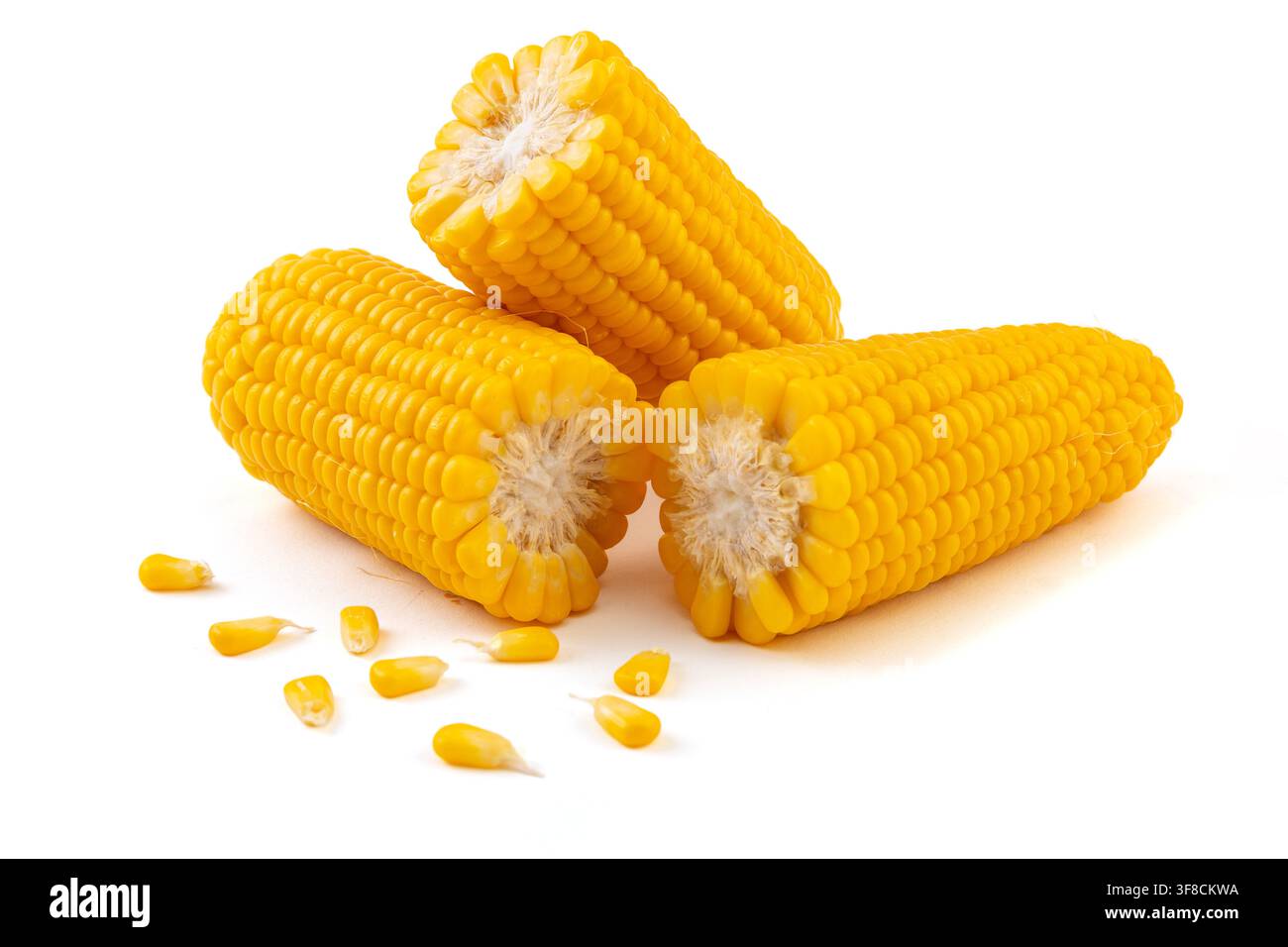 Boiled yellow waxy sweet corn cobs stack isolated on white background Stock Photo