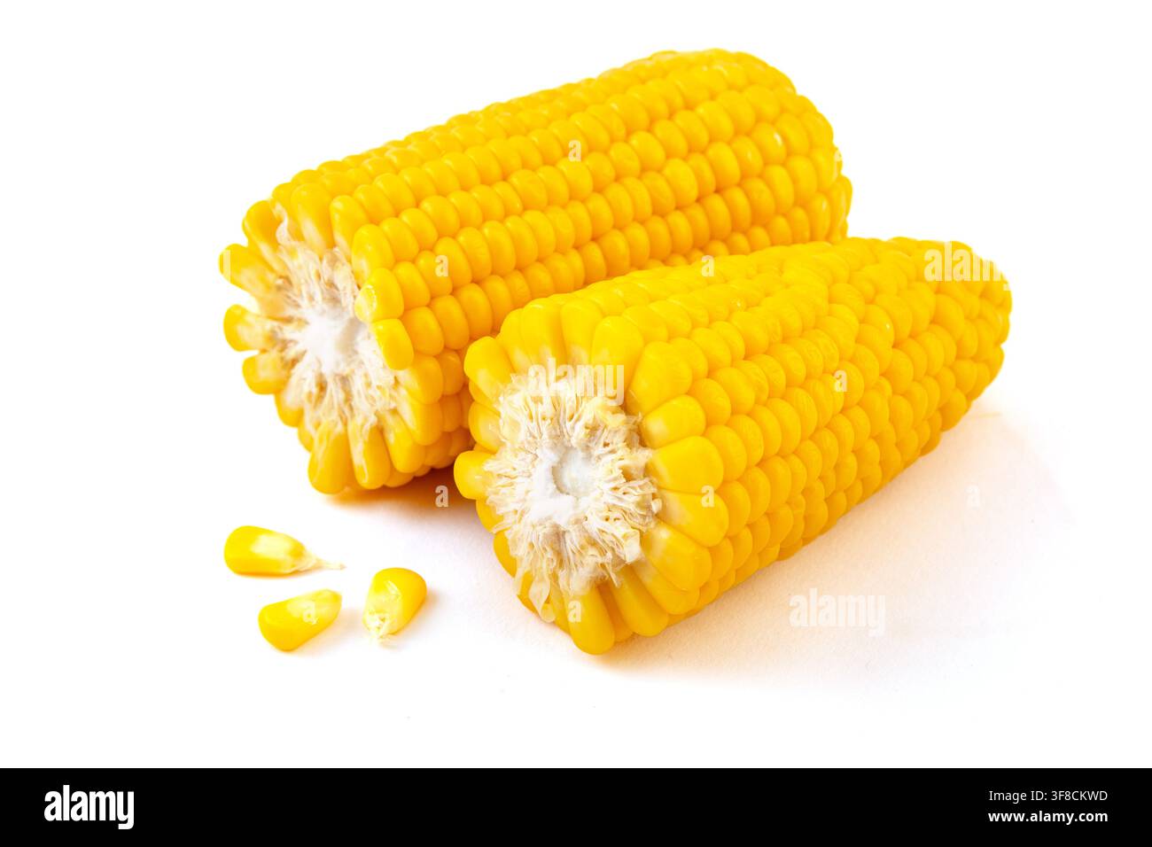 Boiled yellow waxy sweet corn cobs stack isolated on white background Stock Photo
