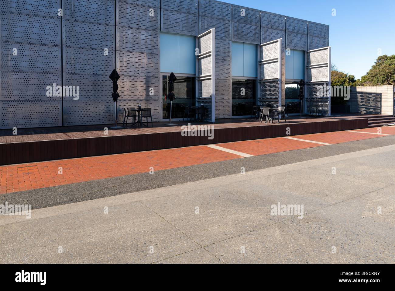 Road, car background, automotive backplate, parking area outside cafe featuring modern architecture Stock Photo