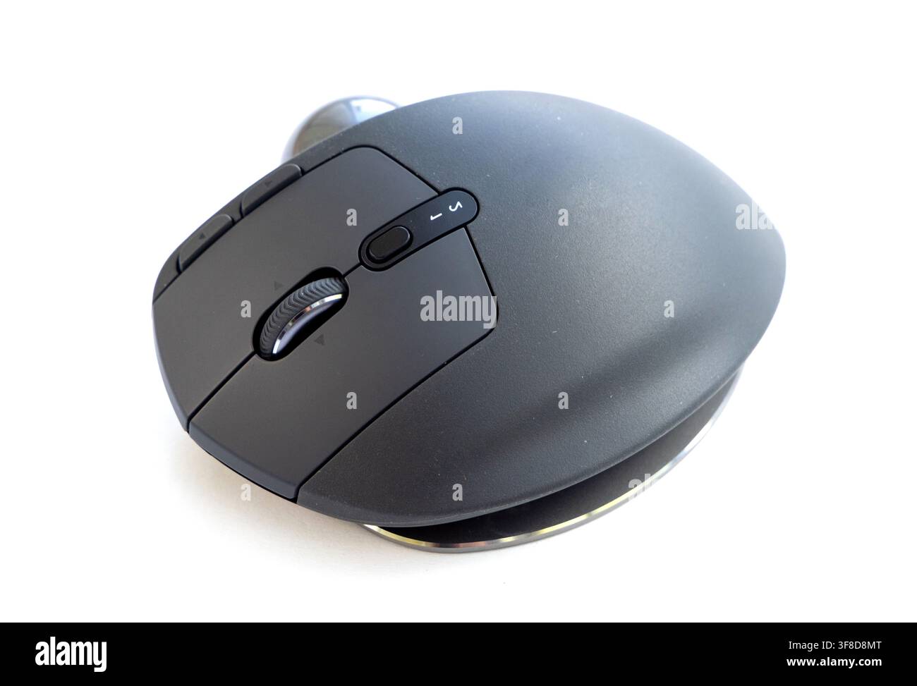 A modern ergonomic computer mouse rests on white background Stock Photo ...