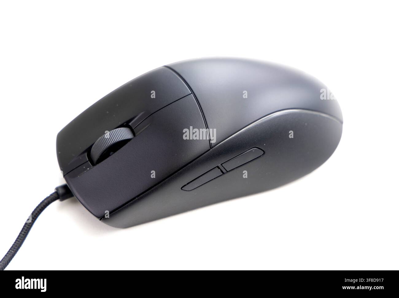 A modern black computer mouse rests on a white background Stock Photo