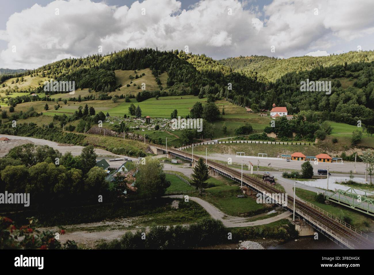 View of church and cemetery in Popoiu, 07/28/2026 Stock Photo - Alamy