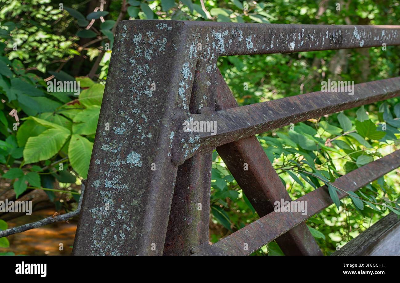 A close-up of a weathered, rusted metal truss structure Stock Photo