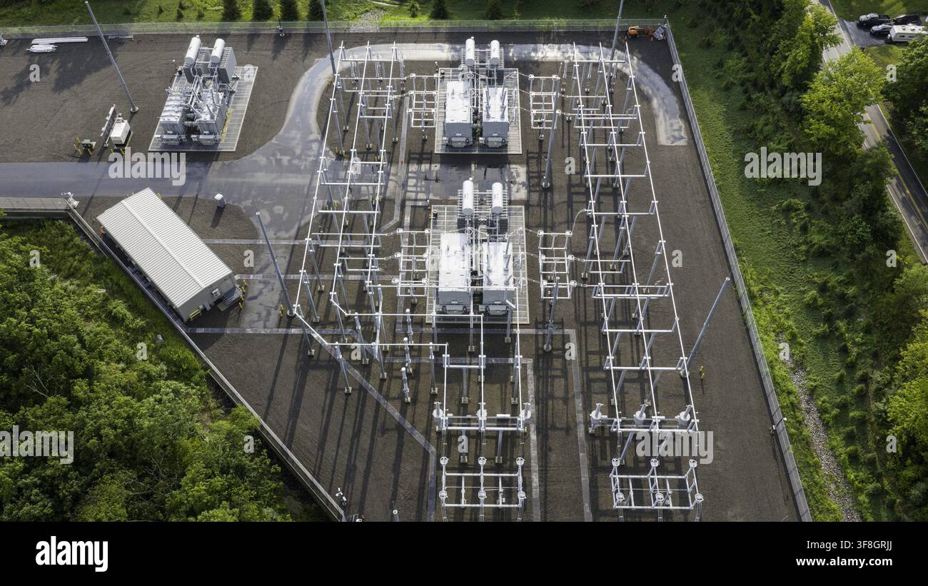 Aerial view of an electrical substation featuring high-voltage power ...
