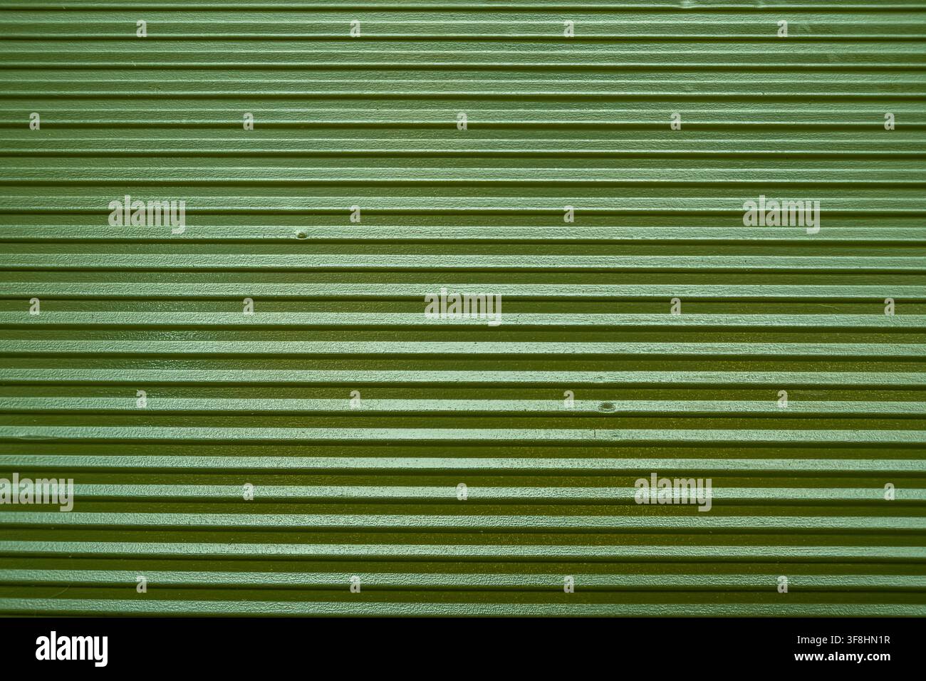 Green corrugated plastic texture full frame background close up. Stock Photo