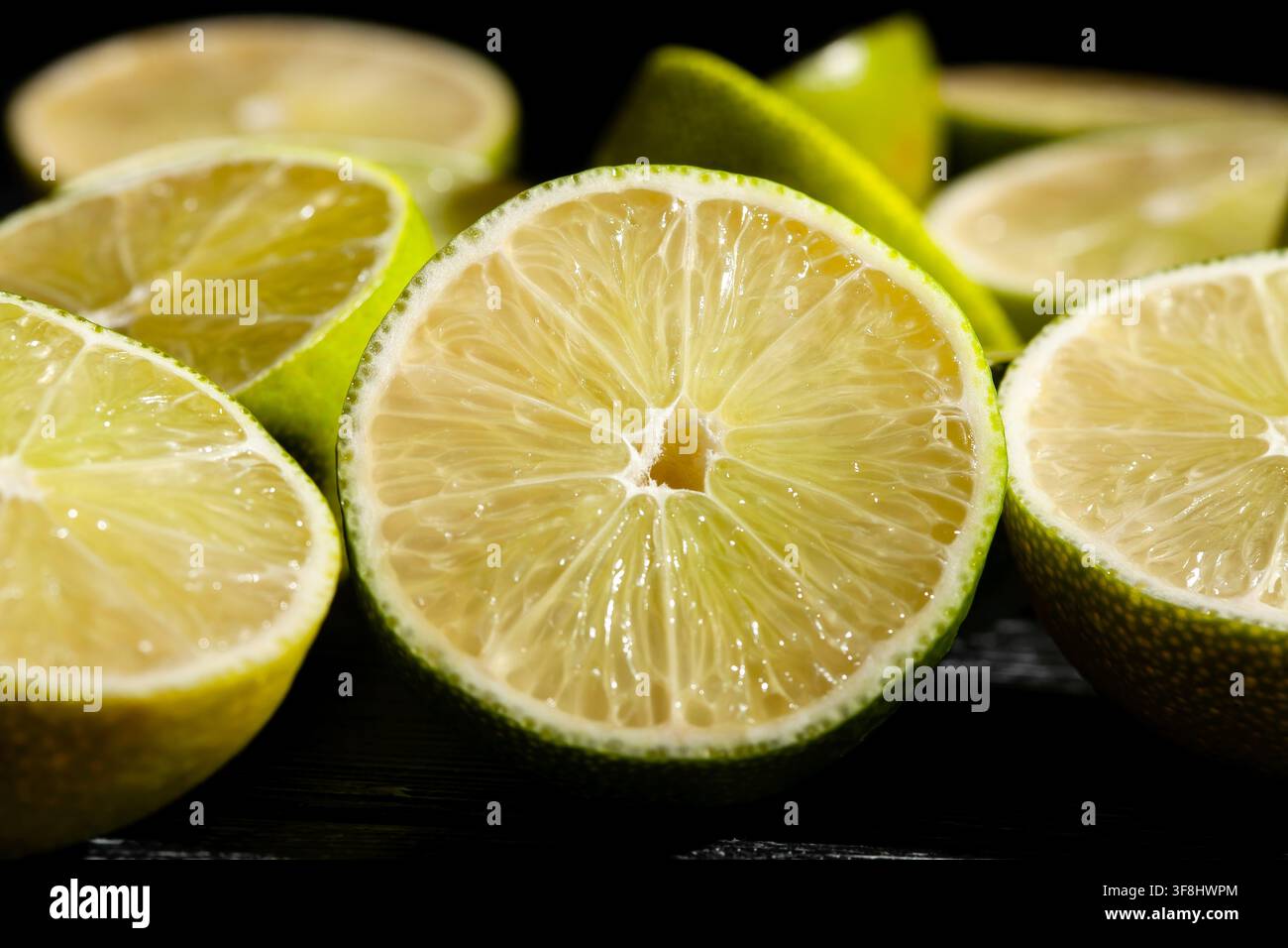 sliced lime on black background Stock Photo