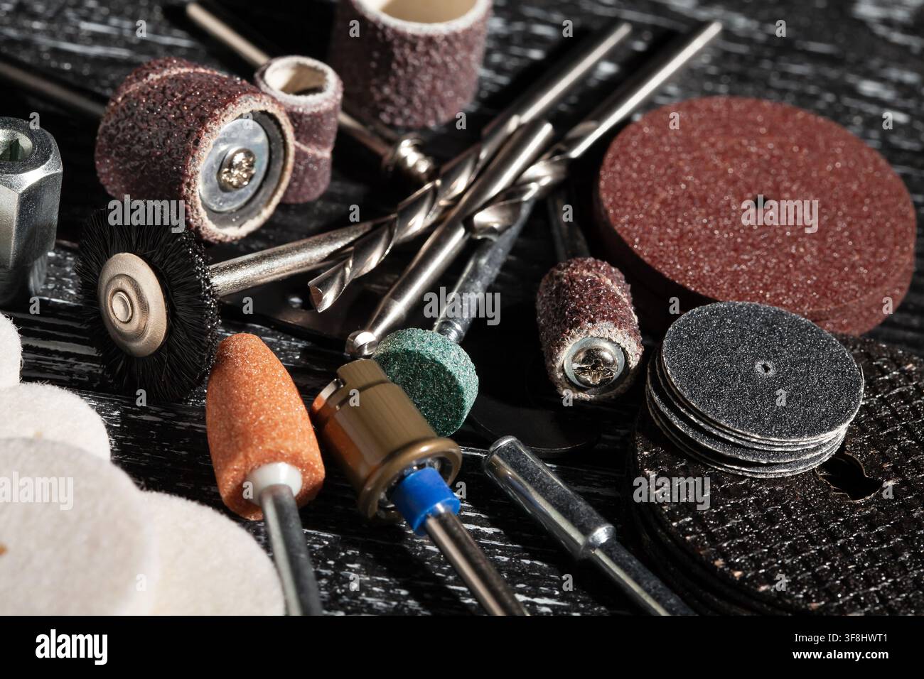 multitool bits set on black wood background Stock Photo