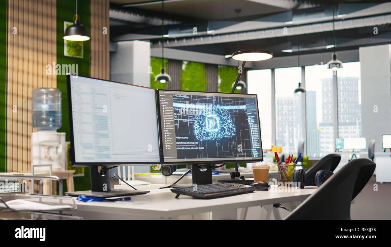 Empty startup office with artificial intelligence program running on PC monitors used by programmers. AI industry startup workspace leveraging machine learning technology Stock Photo