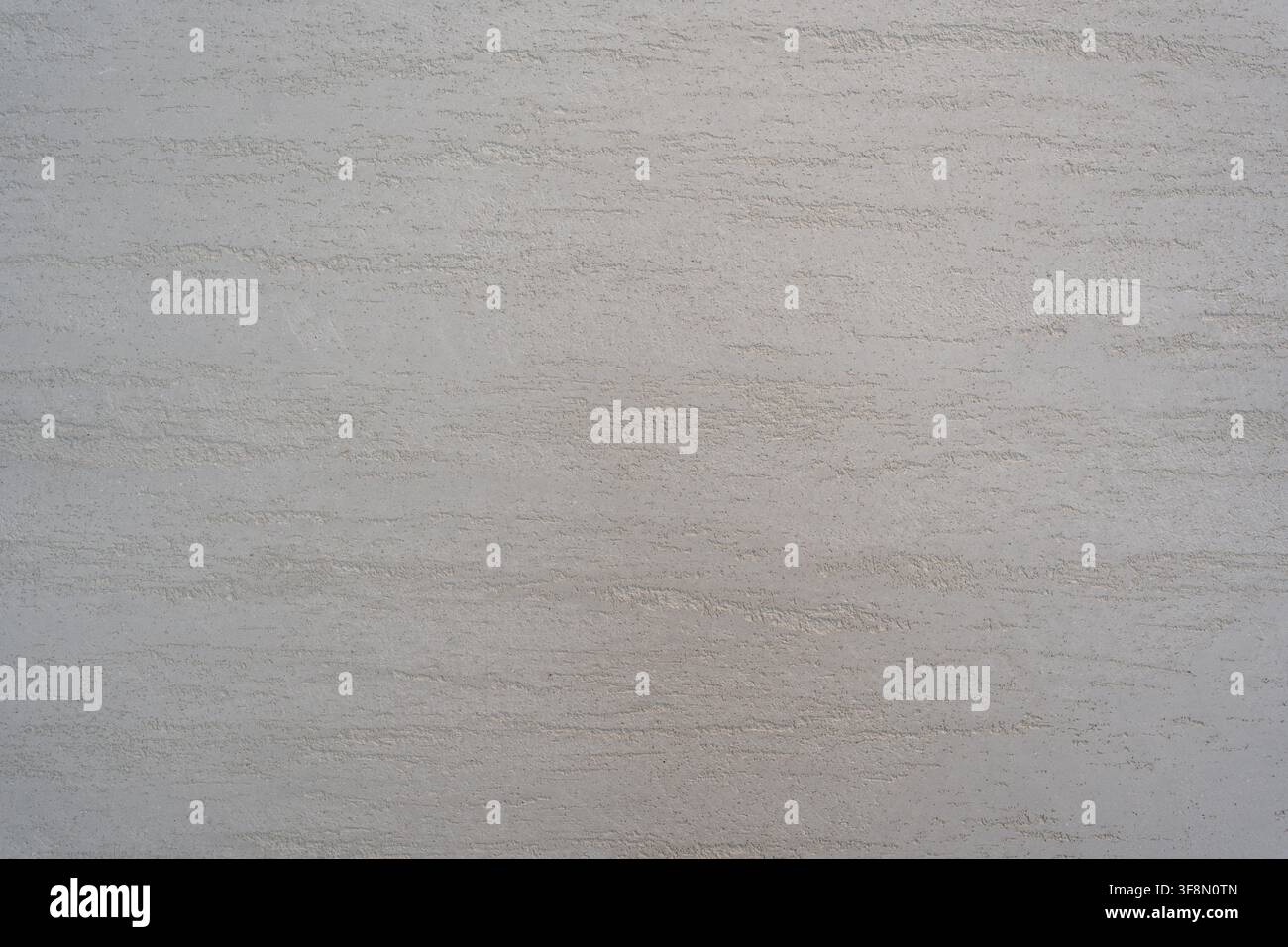 Light grey textured plaster wall surface background with horizontal brush strokes. Stock Photo