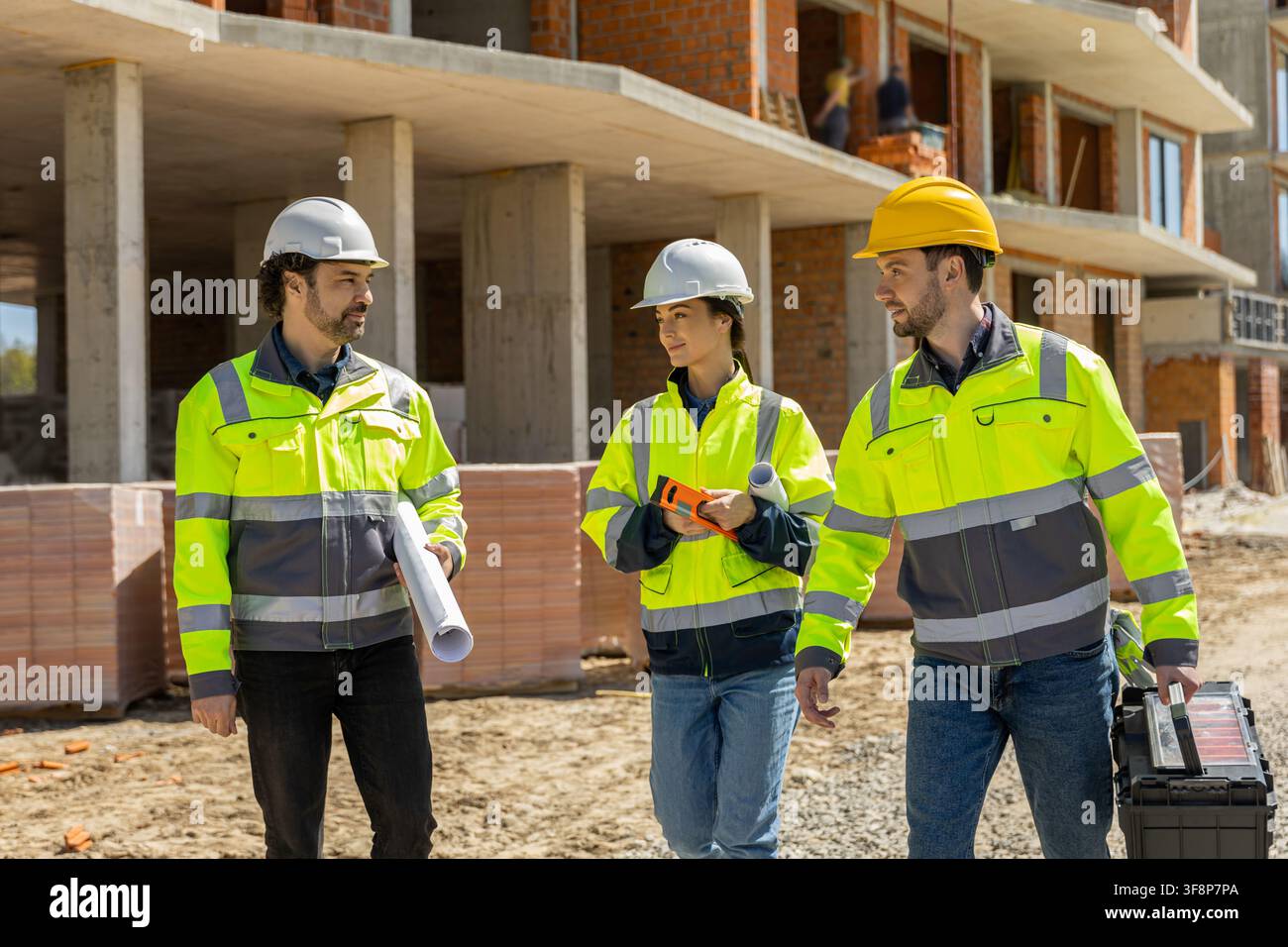 Three professional engineers discussing project Stock Photo