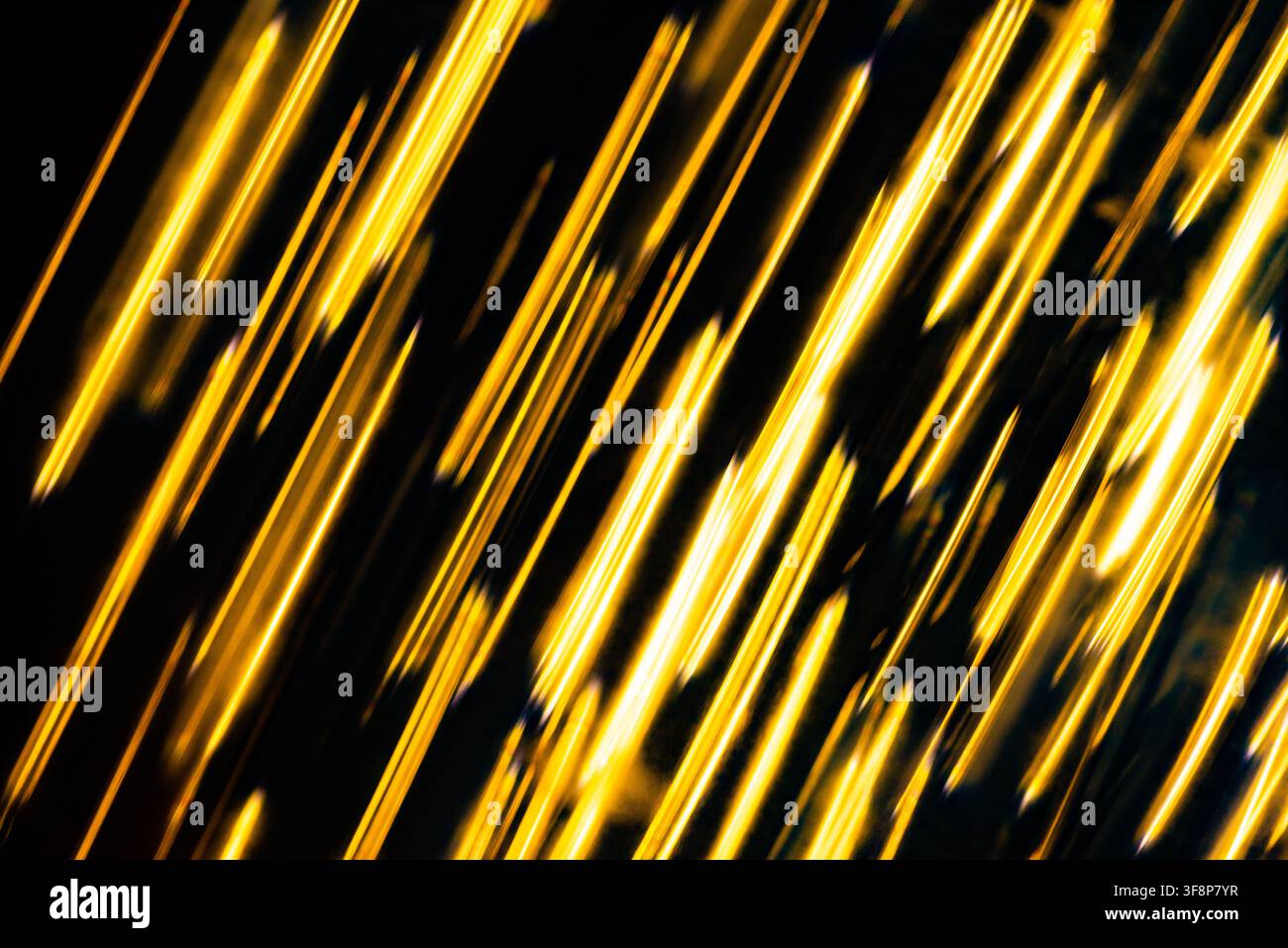 Dynamic motion background of fine yellow lines falling vertically like a matrix digital code Stock Photo