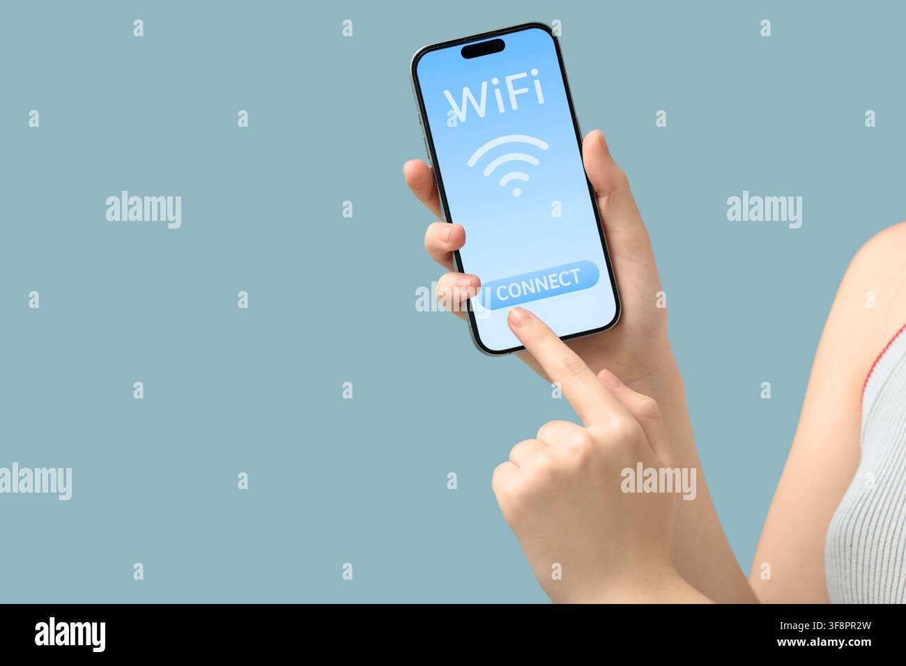 Womans hand holding a smartphone with a wifi connect button on the screen internet access and wireless technology Stock Photo