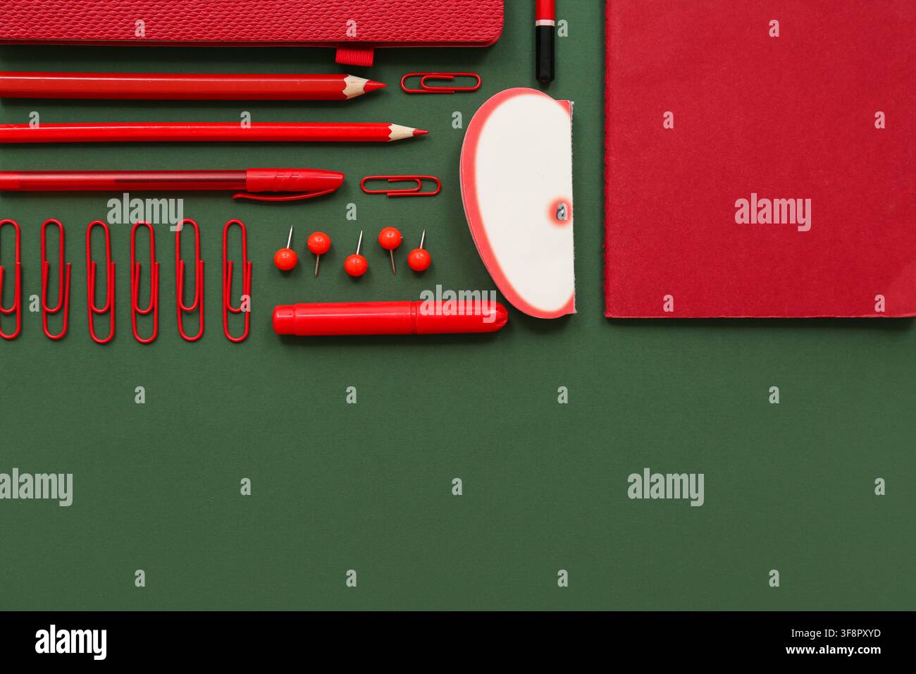 Composition with different stationery on green background Stock Photo