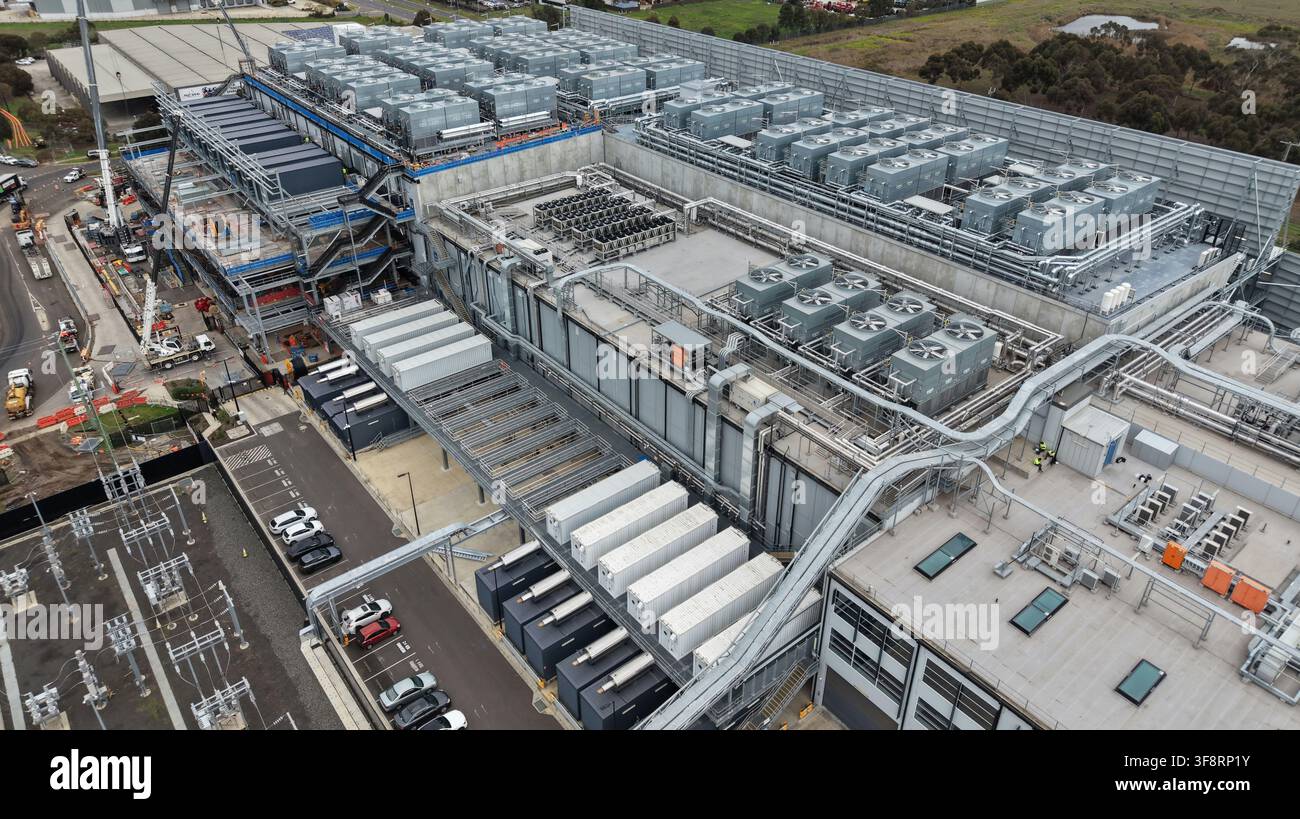 Large data center facility showing complex cooling systems and power components Stock Photo