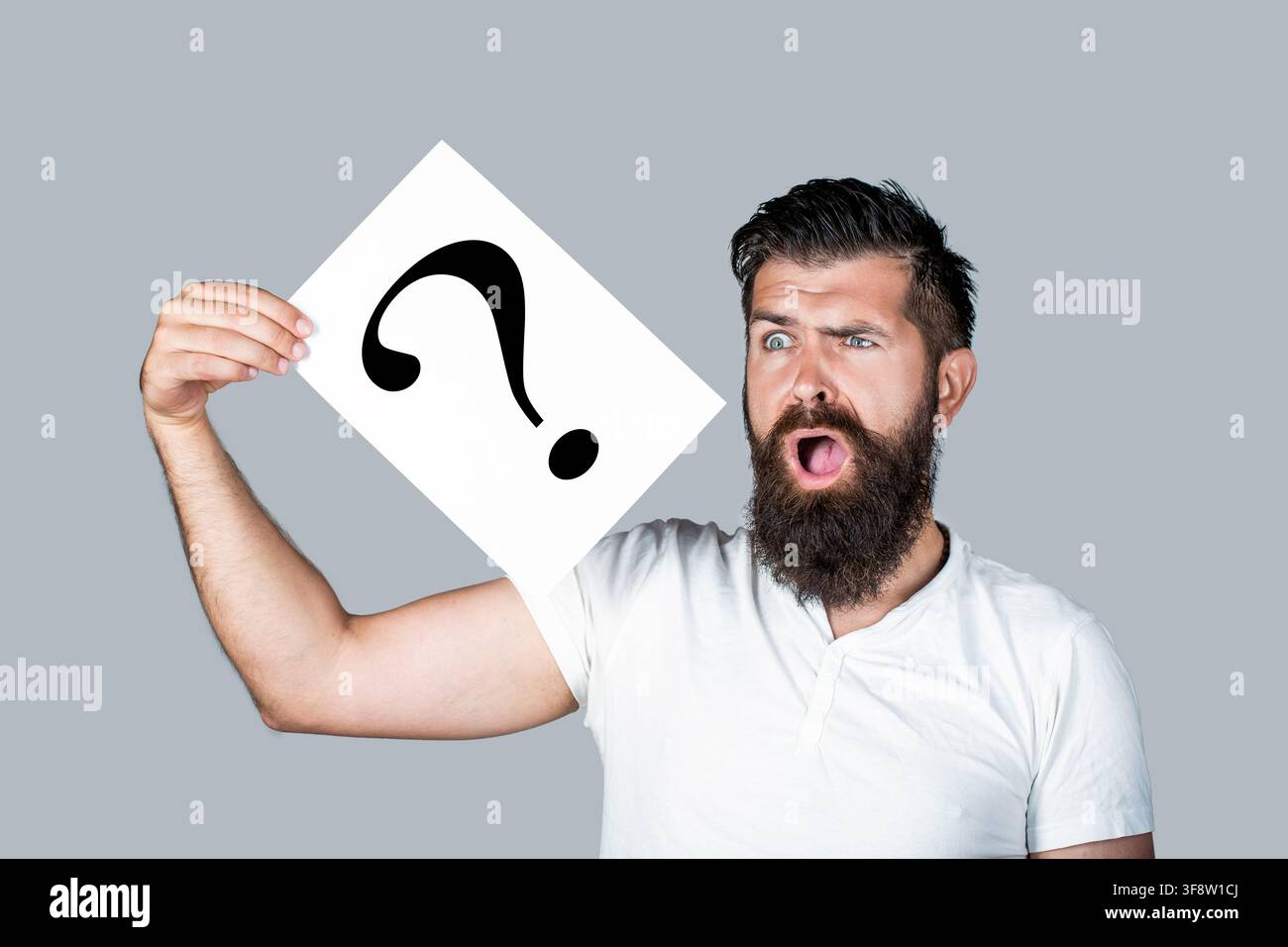 Scream man with question mark. Doubtful man asking questions to himself. Paper notes with question marks. Confused male thinking with question mark Stock Photo