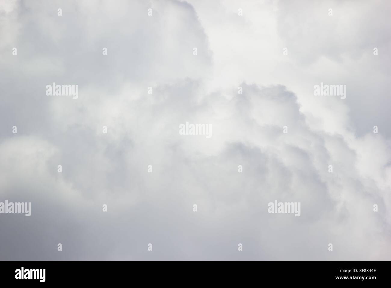 Overcast cloudy sky with soft white and gray storm texture background Stock Photo
